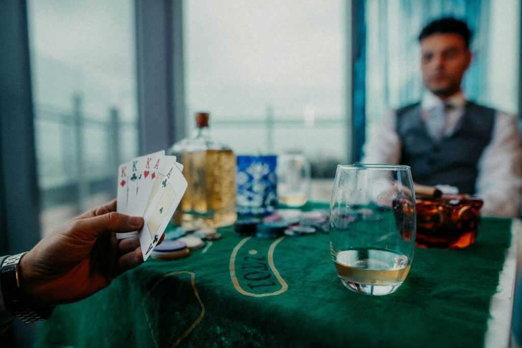 A captivating poker game scene with whiskey in Buenos Aires, illustrating leisure and strategy.